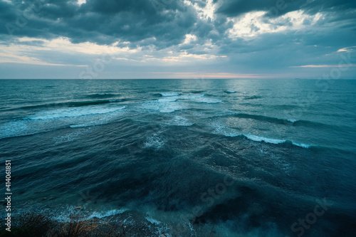 Sea or Ocean Dramatic Seascape Panorama in dark blue moody colors.