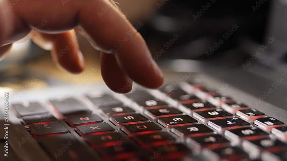 Fototapeta premium Man typing on keyboard of computer.