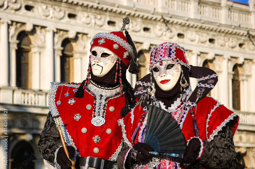 Two Mongol masks  in St Mark's Square during traditional Carnival in Venice, Italy. 