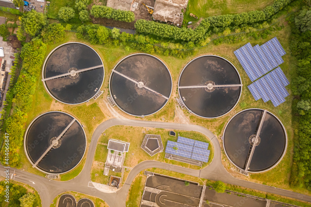 Aerial view of circular water tanks of a factory in Harelbeke, West Flanders, Belgium. Aerial view of circular water tanks of a factory in Harelbeke, West Flanders, Belgium.