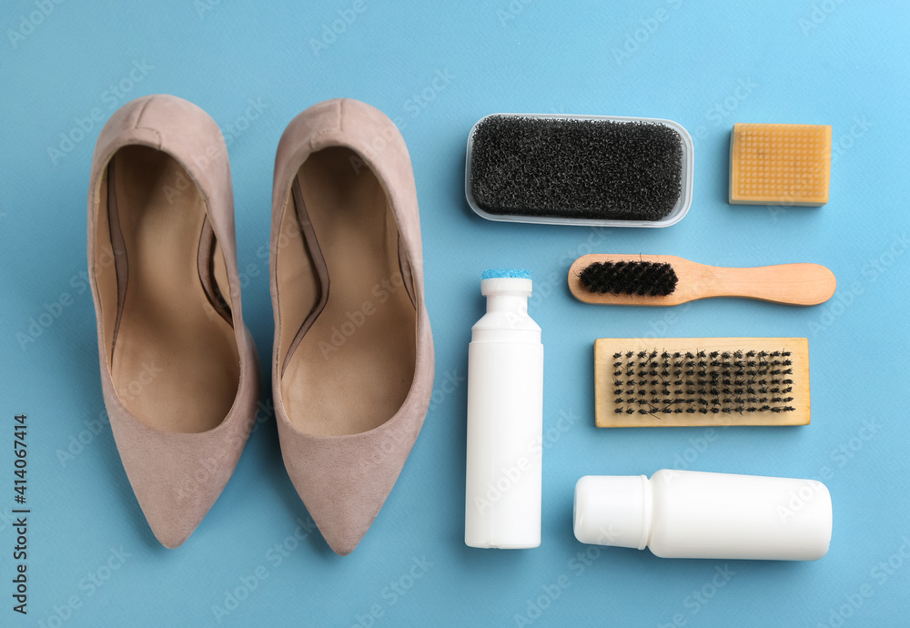 Stylish footwear with shoe care accessories on light blue background, flat lay Stylish footwear with shoe care accessories on light blue background, flat lay