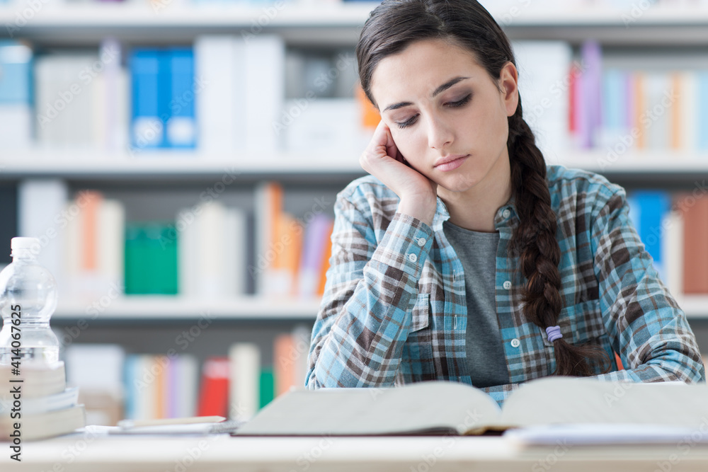 Bored student in the library Bored student in the library