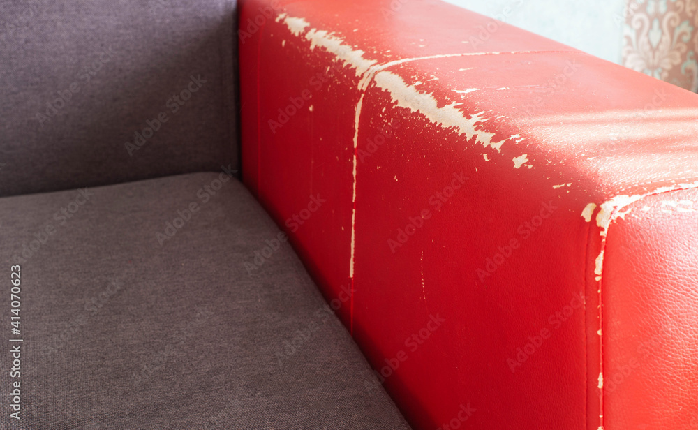 Torn and battered leather back of the sofa. Poor quality leather, leather  cleansing and restoration Stock Photo | Adobe Stock