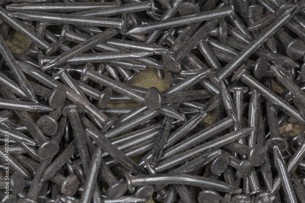 Small thin nails close-up in selective focus Small thin nails close-up in selective focus