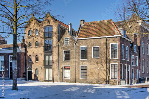 Schiedam, The Nethelrands, February 11, 2021: historic houses on Vismarkt (Fish Market) square on a cold but sunny day in winter
