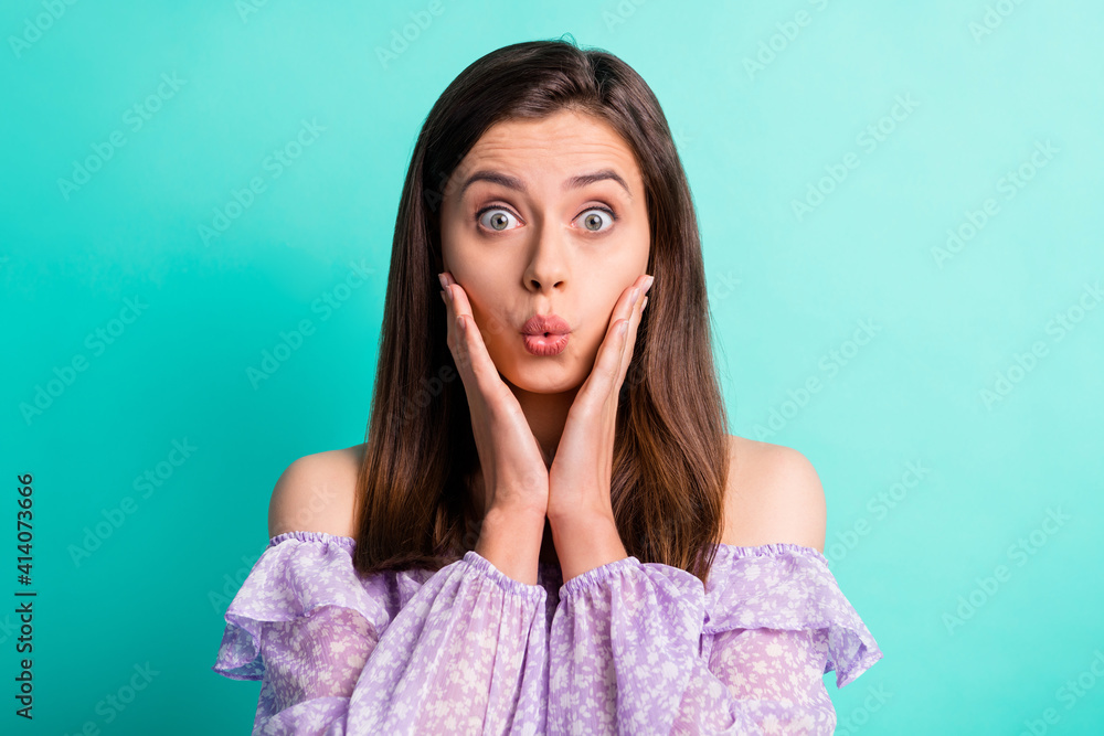 Portrait of impressed stressed girl hands face open mouth wear purple shirt isolated on blue color background Portrait of impressed stressed girl hands face open mouth wear purple shirt isolated on blue color background