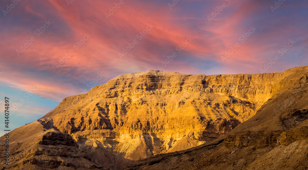 Fototapeta premium Panorama of stony slopes of the mountains against the sky.