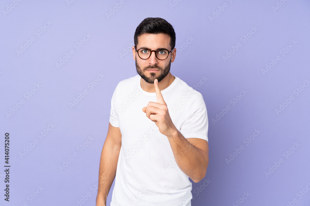 Caucasian handsome man over isolated background frustrated and pointing to the front Caucasian handsome man over isolated background frustrated and pointing to the front