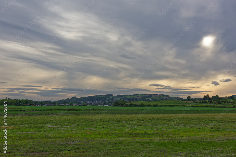 The buildings and Houses of the outskirts of Blairgowrie seen across the Farm Fields set in the Flood Plain of the River Ericht.