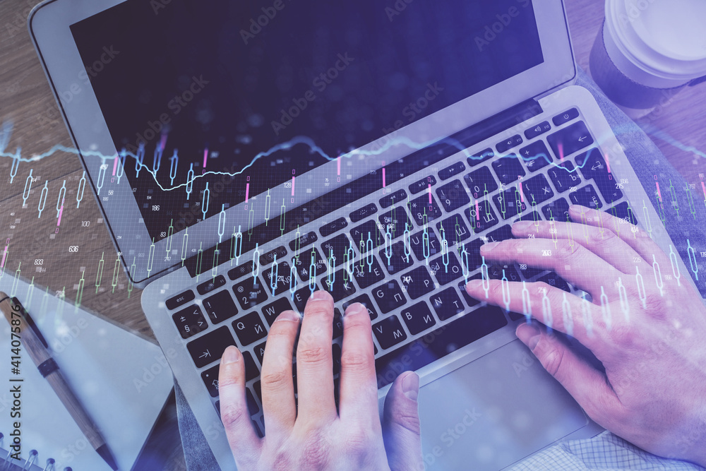 Double exposure of man's hands typing over computer keyboard and forex graph hologram drawing. Top view. Financial markets concept. Double exposure of man's hands typing over computer keyboard and forex graph hologram drawing. Top view. Financial markets concept.