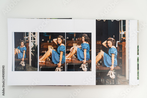 pages of photobook from photo shoots of beautiful brunette woman in retro house. photo