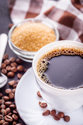 cup of fragrant fresh coffee on a dark stone background © Narsil
