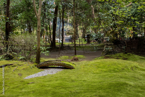 Tablou pe pânză Beautiful view of Zen garden with a small bridge over a dry river in Japan
