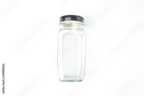 Empty glass jar over white background.