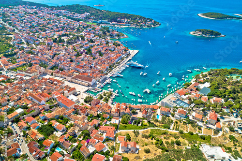 Town of Hvar bay and yachting harbor aerial view