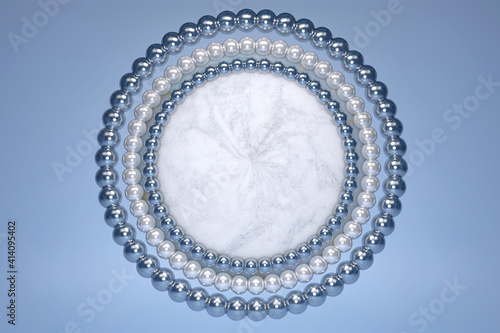 3D beautiful blue marble effect circle podium with white shining pearl decoration border and circle on blue pastel background. Minimal scene with geometrical. Scene to show cosmetic product. Top view