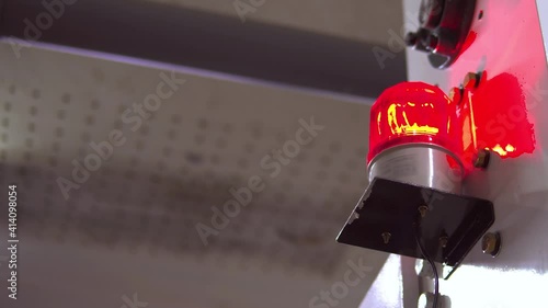 blurred low key Illuminated factory industry red alert emergency light with copy space for background. Attention concept, tragedy, emergency, safety and insurance
