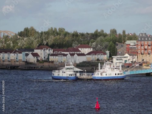 Small ferries docked on river.  Public transport by water photo