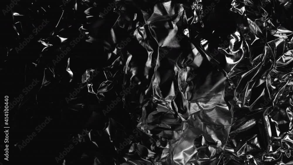 Light Passes On Crumpled Aluminium Foil. - close up Light Passes On Crumpled Aluminium Foil. - close up