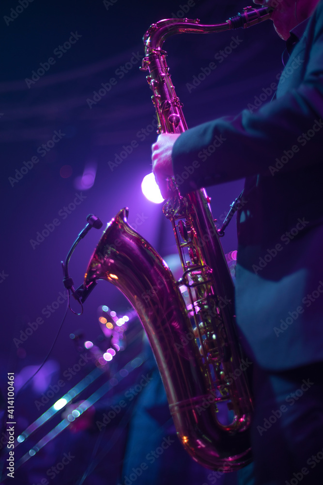Fototapeta premium musician with saxophone in concert