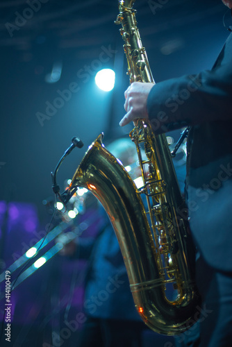 musician with saxophone in concert