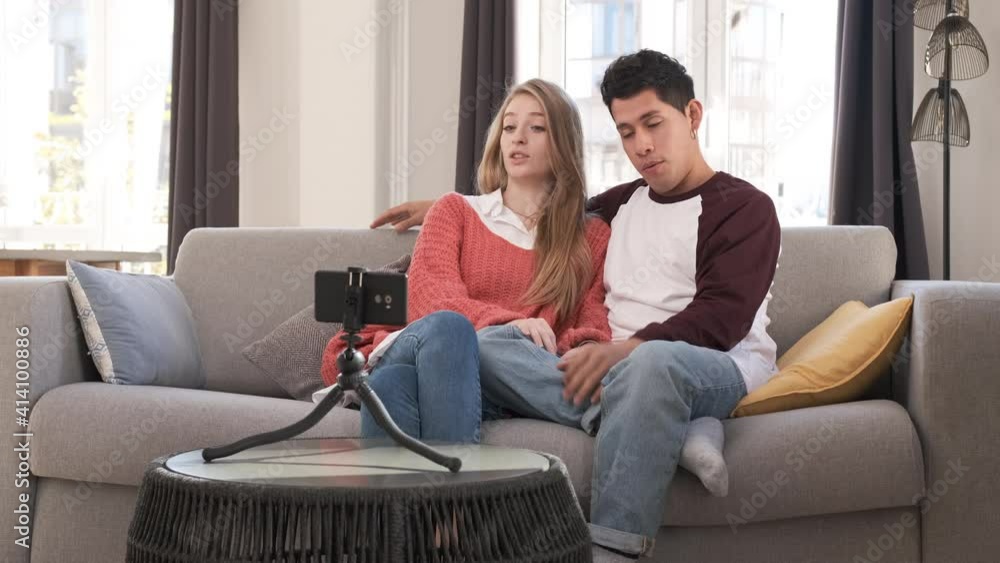 Young bloggers creating content for social media while making a video at home. Young bloggers creating content for social media while making a video at home.