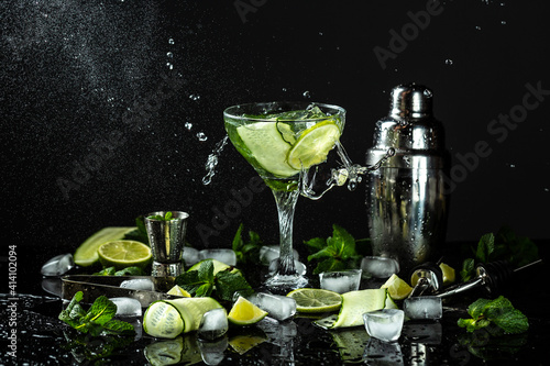 Gin-tonic alcoholic cocktail. liquor, ice. Freeze motion, drops in liquid splash
