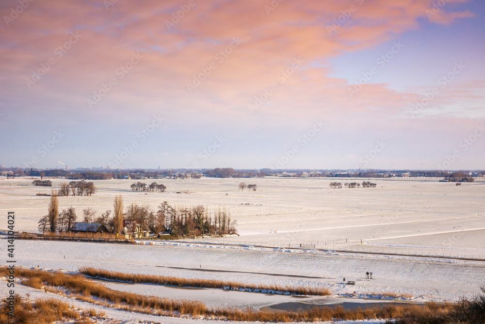 Snowy landscape with hills and meadows in Buytenpark Zoetermeer, the Netherlands