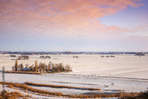 Snowy landscape with hills and meadows in Buytenpark Zoetermeer, the Netherlands © Sander Meertins