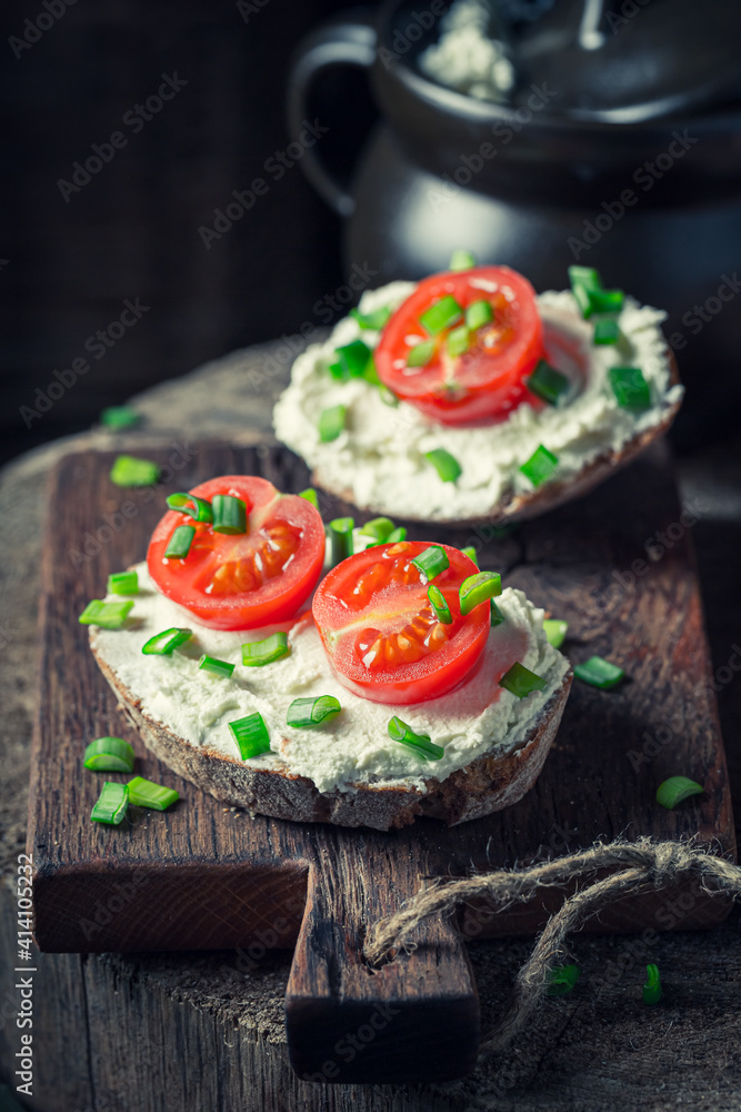 Homemade sandwich with fromage cheese and cherry tomatoes