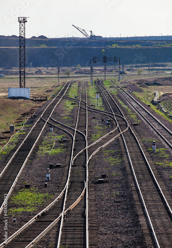 Railway station "Bogatyr" near coal quarry. Rail tracks and dragline excavator on background. Ekibastuz, Kazakhstan. 