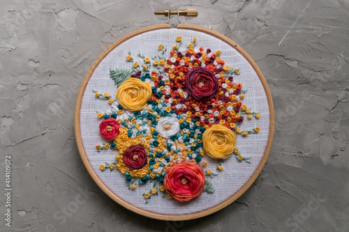 Floral embroidery on a gray concrete background  photo