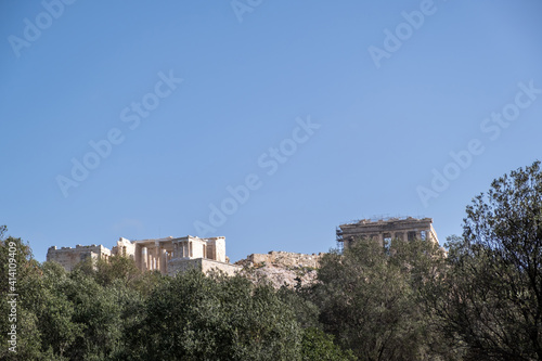 Acropolis of Athens Greece rock and Parthenon on blue sky background, sunny day.