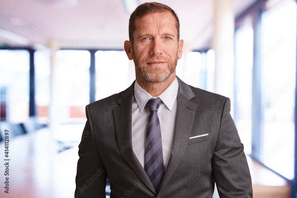 Financial advisor businessman standing at the office Financial advisor businessman standing at the office