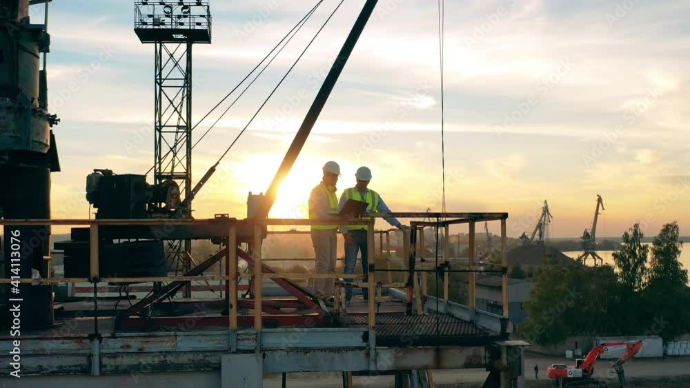 Industrial engineers are discussing plans in the quarry zone