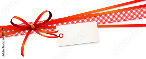 red colored ribbon bow with hang tag