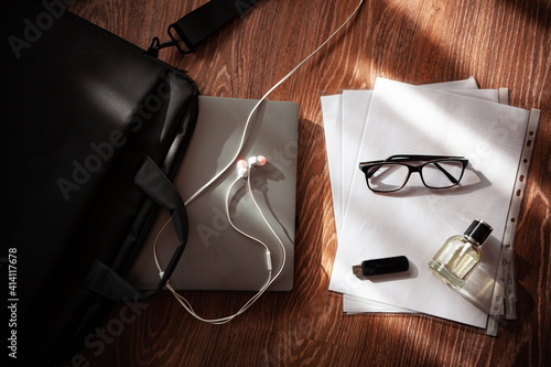 office paper laptop and glasses