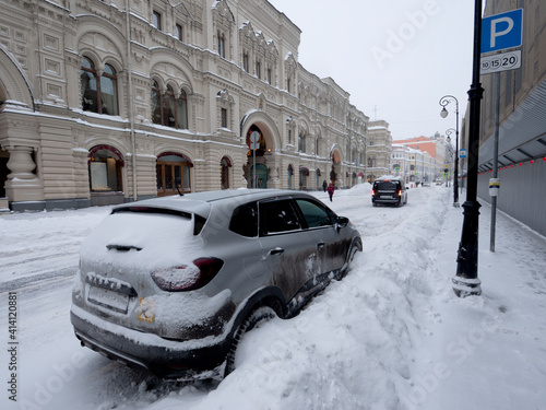 Moscow, Ilyinka street in winter filled with snow photo