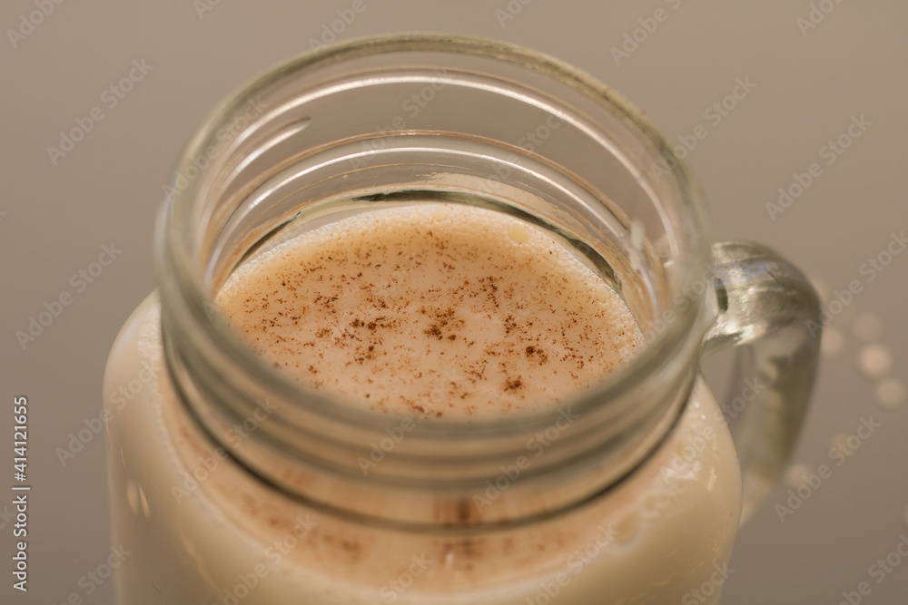Oatmeal drink with flakes on table Oatmeal drink with flakes on table