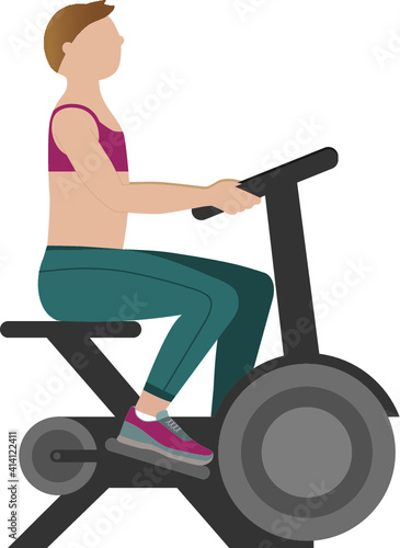 Woman practicing in exercise bicycle