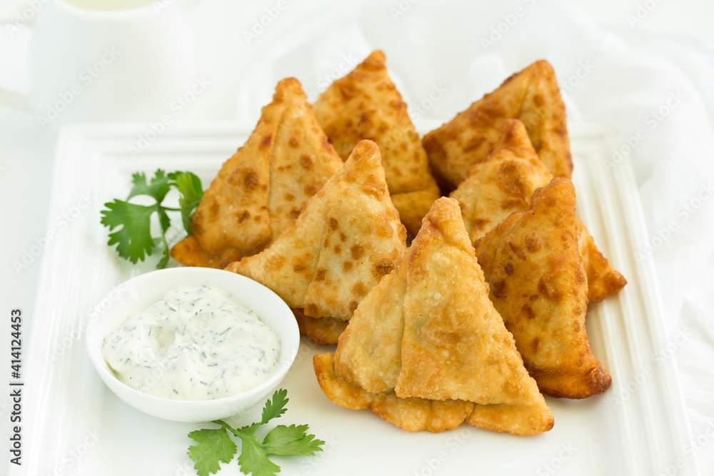 Asian food. Vegetarian samsa (samosas) with tomato sauce Asian food. Vegetarian samsa (samosas) with tomato sauce
