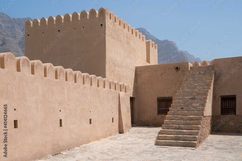 Courtyard of a small medieval arabian fort in Bukha, Oman. Stairs and square tower.