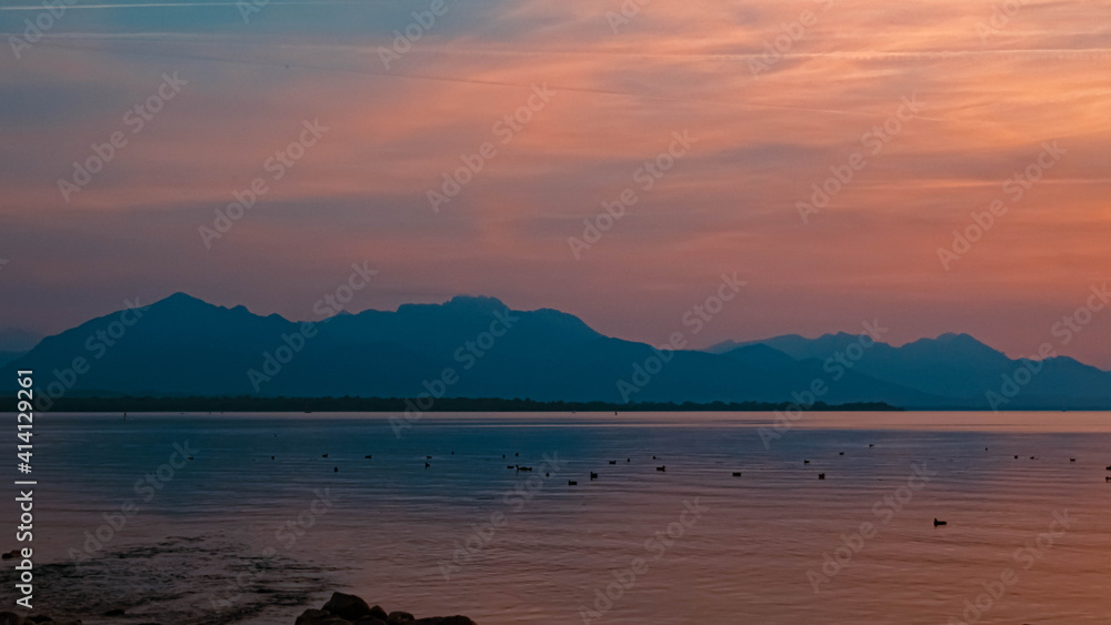 Beautiful sunset with reflections at the famous Chiemsee, Chieming, Bavaria, Germany