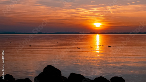 Beautiful sunset with reflections at the famous Chiemsee, Chieming, Bavaria, Germany © Martin Erdniss