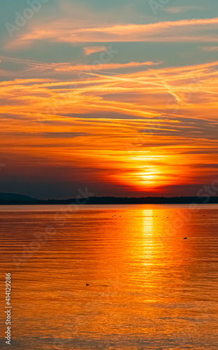 Beautiful sunset with reflections at the famous Chiemsee  Chieming  Bavaria  Germany