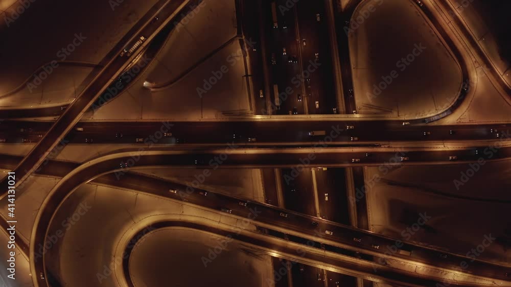 Aerial overhead view of a road intersection traffic in winter at night Aerial overhead view of a road intersection traffic in winter at night