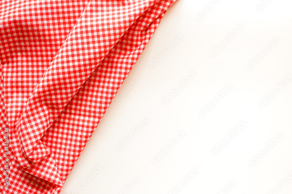 crumble pink plaid fabric or tablecloth on white background with copy space. crumble pink plaid fabric or tablecloth on white background with copy space.