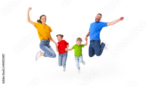 Delighted family jumping together in studio