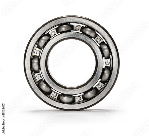A clean new metal ball bearing against a white background.
