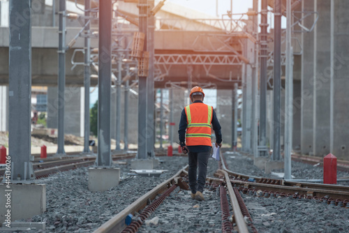 engineer walking and check track work on railways. people  walk on railway. © VIEWFOTO STUDIO